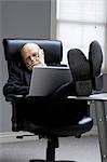 Closeup of businessman in office sleeping
