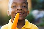 Closeup of boy holding popsicle
