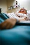 Boy sleeping in hospital bed