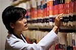 Female doctor looking at patient records