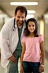 Portrait of a male doctor and girl