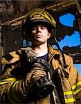 Portrait of a firefighter with fire hose