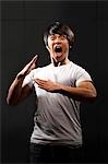 Muscular man with clenched fist shouting