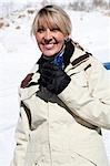 Female outside in the snow drinking bottled water