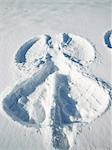 Woman making snow angel