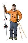 Male skier in orange ski jacket