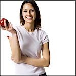 Woman holding a red apple