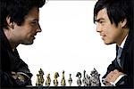 Two businessmen playing chess