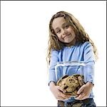 Young girl holding cookie jar