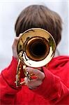 Close-up of Boy Playing Trumpet