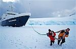 'Towing the ship' Expedition ship 'Clipper Adventurer' garaged in sea-ice