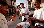 A group of young boys drum together in the favela where they live in Sao Paulo,Brazil.