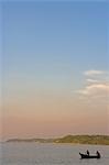 Fishermen returning to home at the end of the day on the Amazon River in the Amazonas Region of Brazil