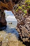 Brazil,Bahia,Barra Grande,Ilha da Pedra Furada (holed stone Island). The sea arch from which the island gets it name at low tide.