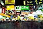 Shoppers descend on the neon lit streets of the Yau Ma Tei district in Kowloon,Hong Kong