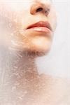 Woman's Lips Behind Frozen Glass