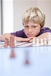 Boy playing chess