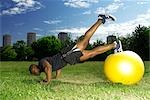 man doing press ups on gym ball