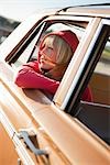 Woman Leaning Out the Window of a Vintage Car, Santa Cruz, California, USA