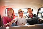 Group of Friends in the Back Seat of a Vintage Car, Santa Cruz, California, USA