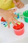 young girl playing with colours