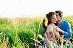 Couple kissing in a wheat field