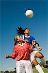 Girls (13-17) attempting to head soccer ball