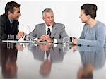 Three business colleagues in conference meeting