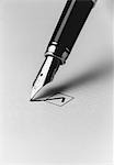 Tip of fountain pen marking checkbox, (b&w), (close-up)