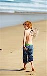 Boy Playing on Beach