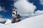 Mountain climber reaching snowy peak