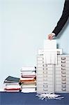 Man shredding document, close-up of hand, in office