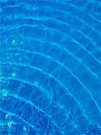 Rippled blue water in swimming pool, view from above