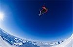 Skier jumping, against blue sky