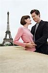 France, Paris, Couple embracing with Eiffel Tower in distance