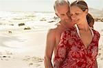Romantic couple on beach, smiling
