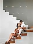 Affectionate Young Couple on Stairs