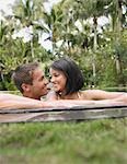 Happy Young Couple in Swimming Pool