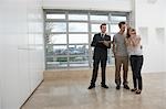 Real estate agent showing couple new apartment