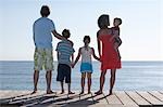 Family with three children (2-11) on jetty