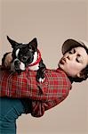 Young woman holding French Bulldog