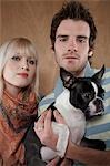 Young couple with French Bulldog, portrait