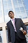 Business people wearing sunglasses on city rooftop