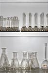 Laboratory flasks on shelves