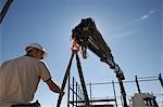 Unloading RSJs (rigid steel joists) from truck to build warehouse