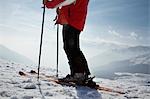 Skier in mountains, low section