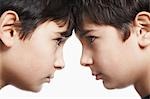 Twin boys (13-15) head to head, close-up