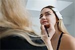 Model Having Makeup Applied