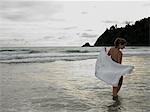 Young Woman Wading in Ocean