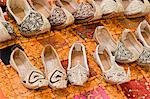 Dubai, UAE, Genie style sandals are for sale in the Bur Dubai souq in women’s and children’s sizes.